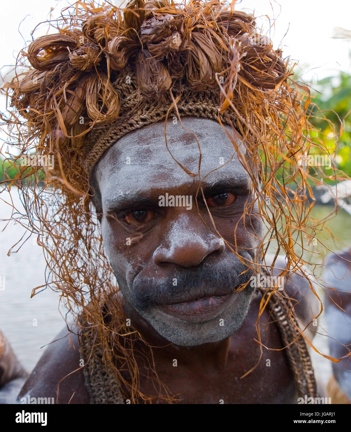 INDONESIA, IRIAN JAYA, ASMAT PROVINCE, JOW VILLAGE - JANUARY 19: The Portrait Asmat warrior with a traditional painting and coloring on a face. Stock Photo