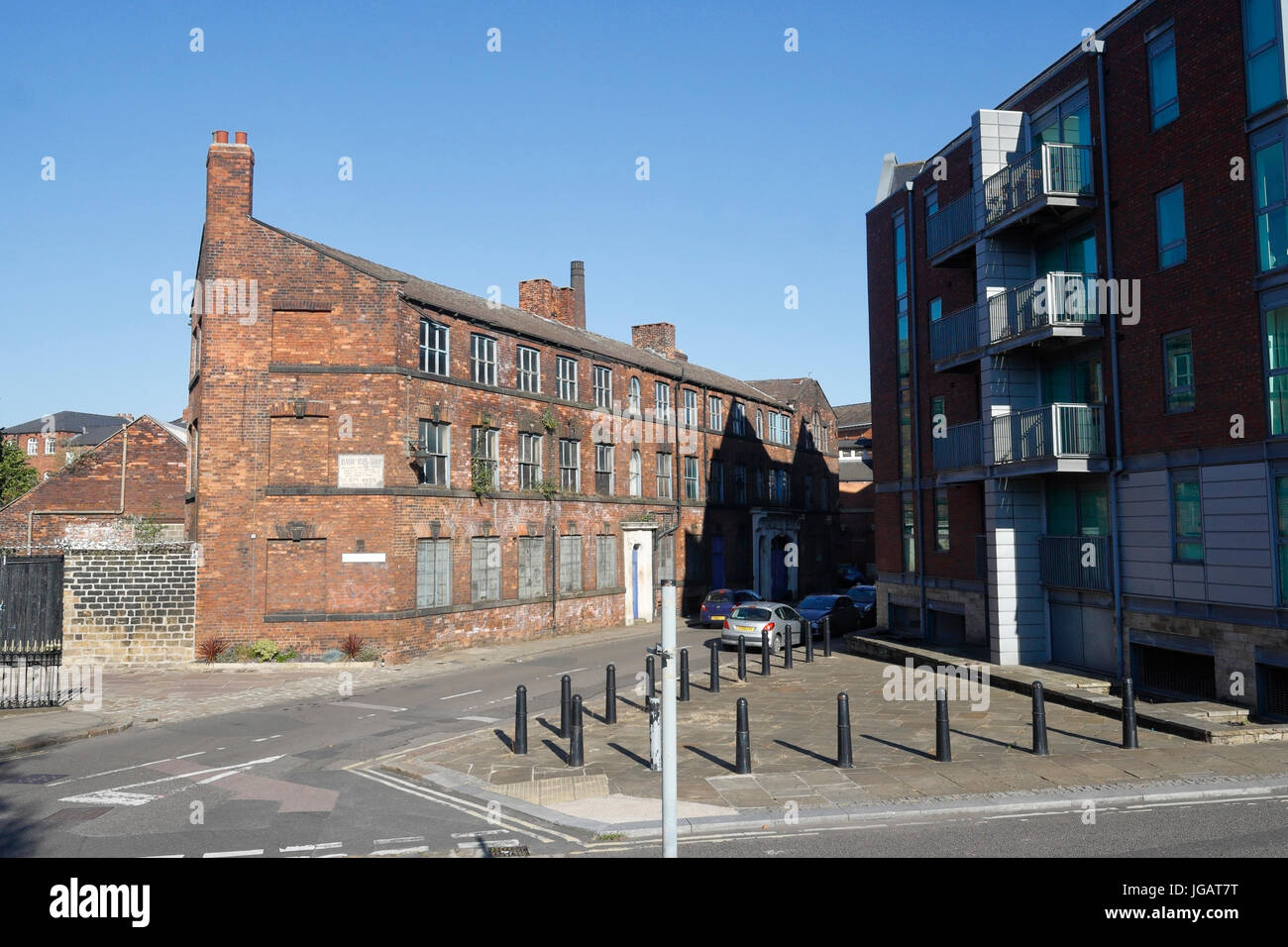 Abandoned factory alongside new housing, Sheffield, England, UK Stock