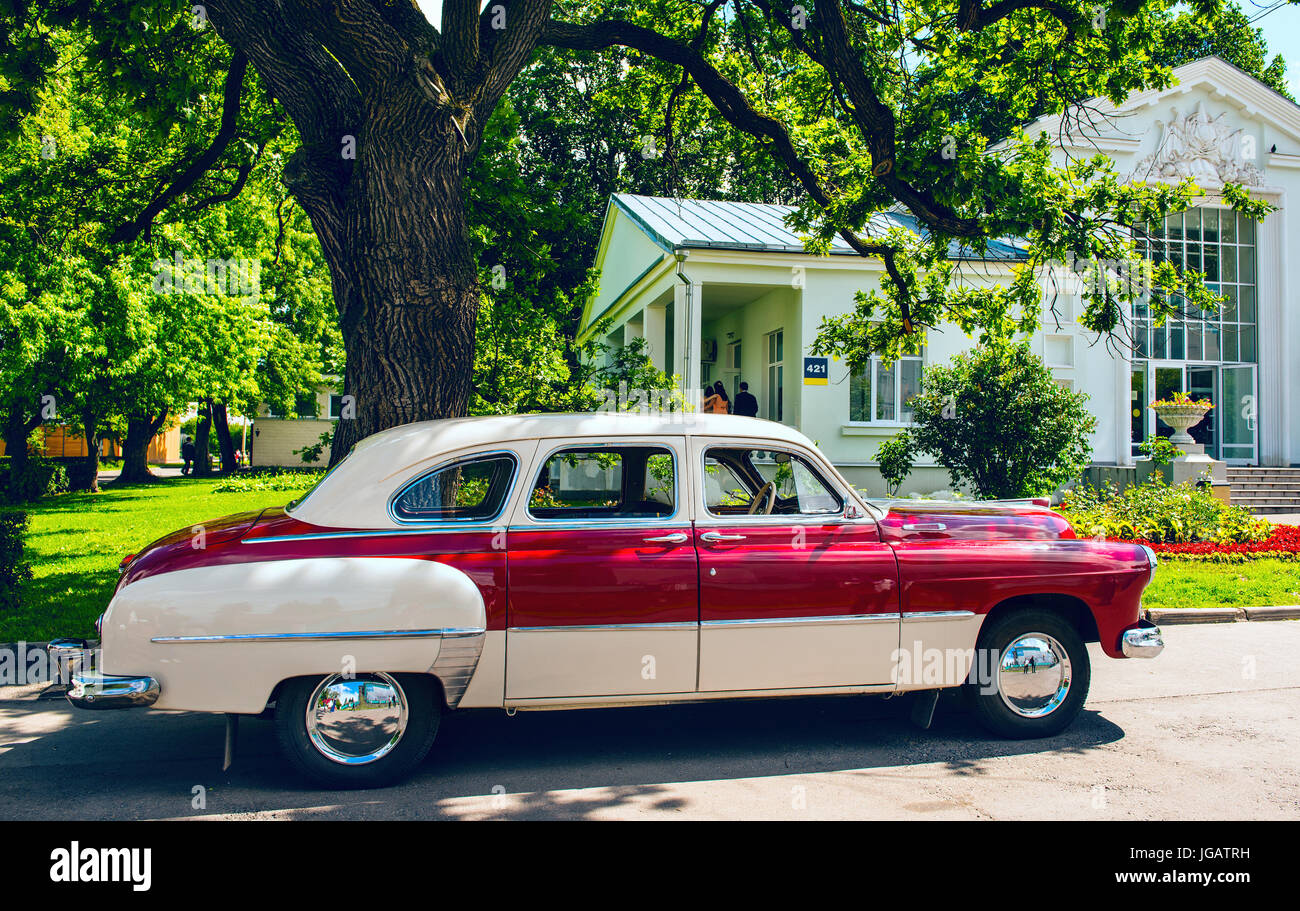 Retro car parked near the house Stock Photo - Alamy