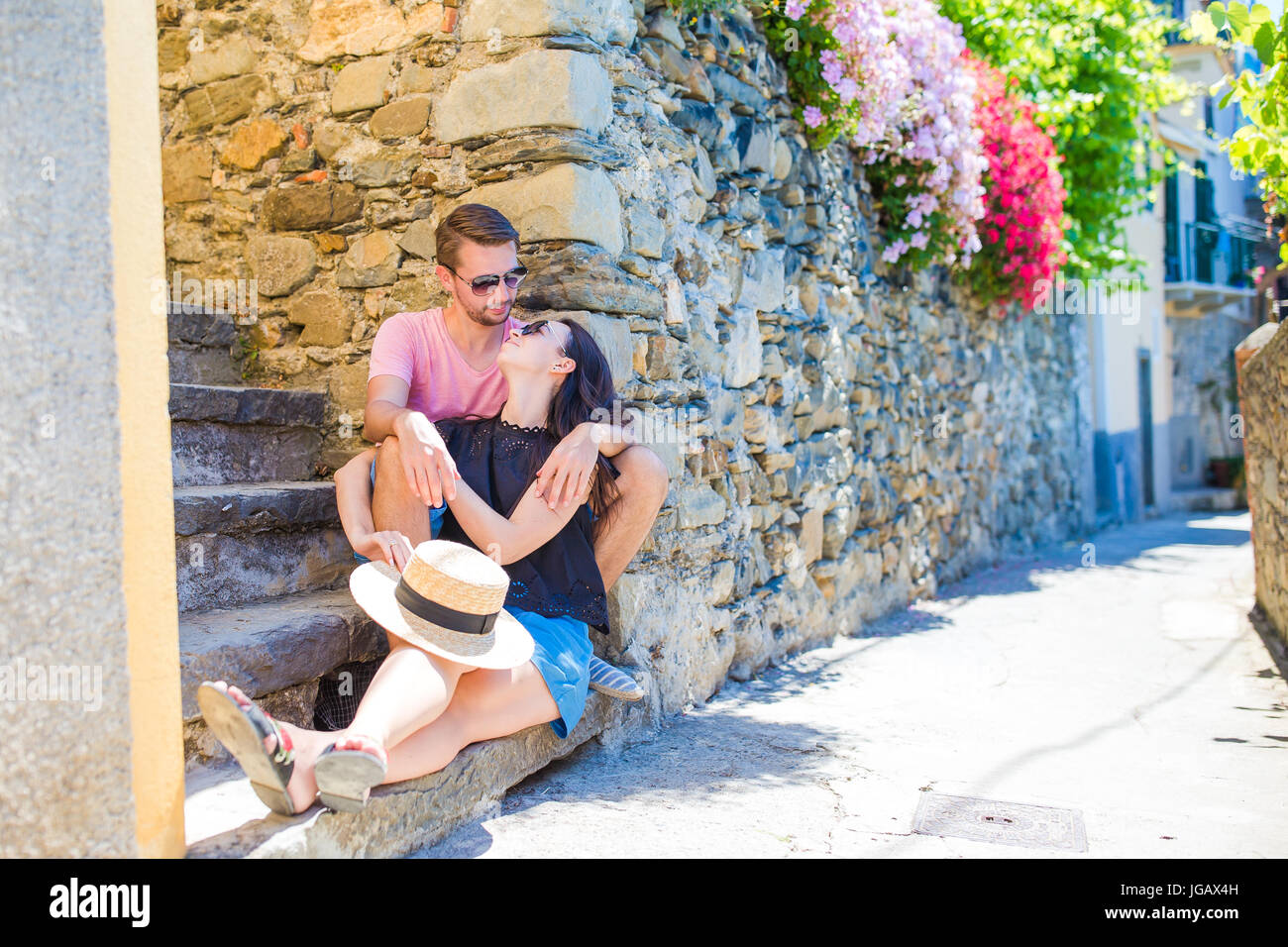 Happy couple traveling at italian old village on european holidays outdoors in Cinque Terre Stock Photo