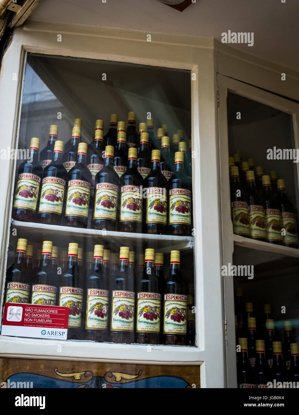 Bottles Of Ginjinha In A Glass Display Cabinet At A Cafe In Lisbon