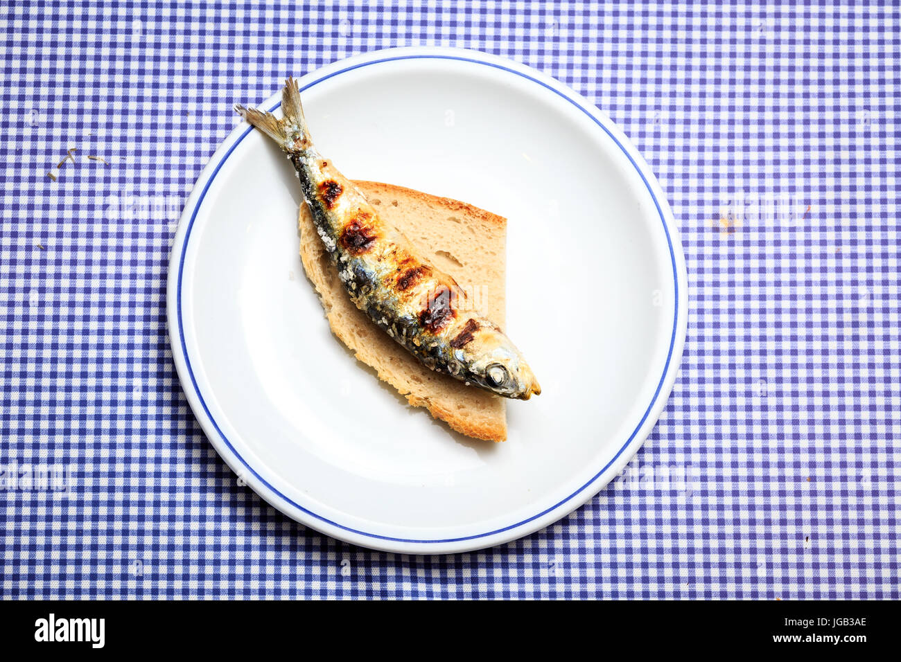 Grilled sardine on slice of bread, Portugal Stock Photo Alamy