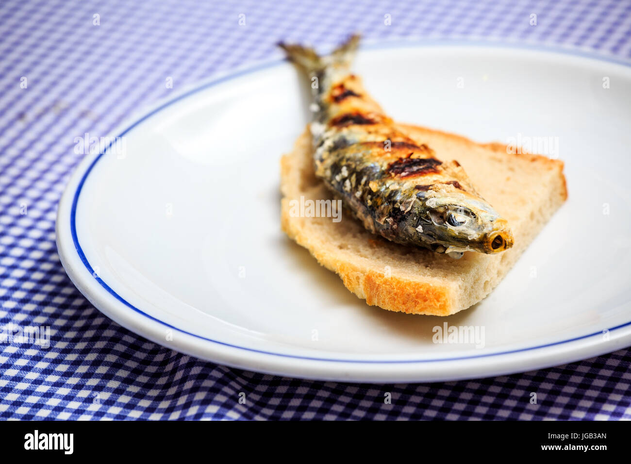 Grilled sardine on slice of bread, Portugal Stock Photo Alamy