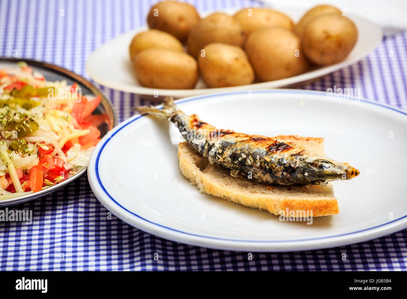 Grilled sardines with salad, bread and potato, Portugal Stock Photo Alamy