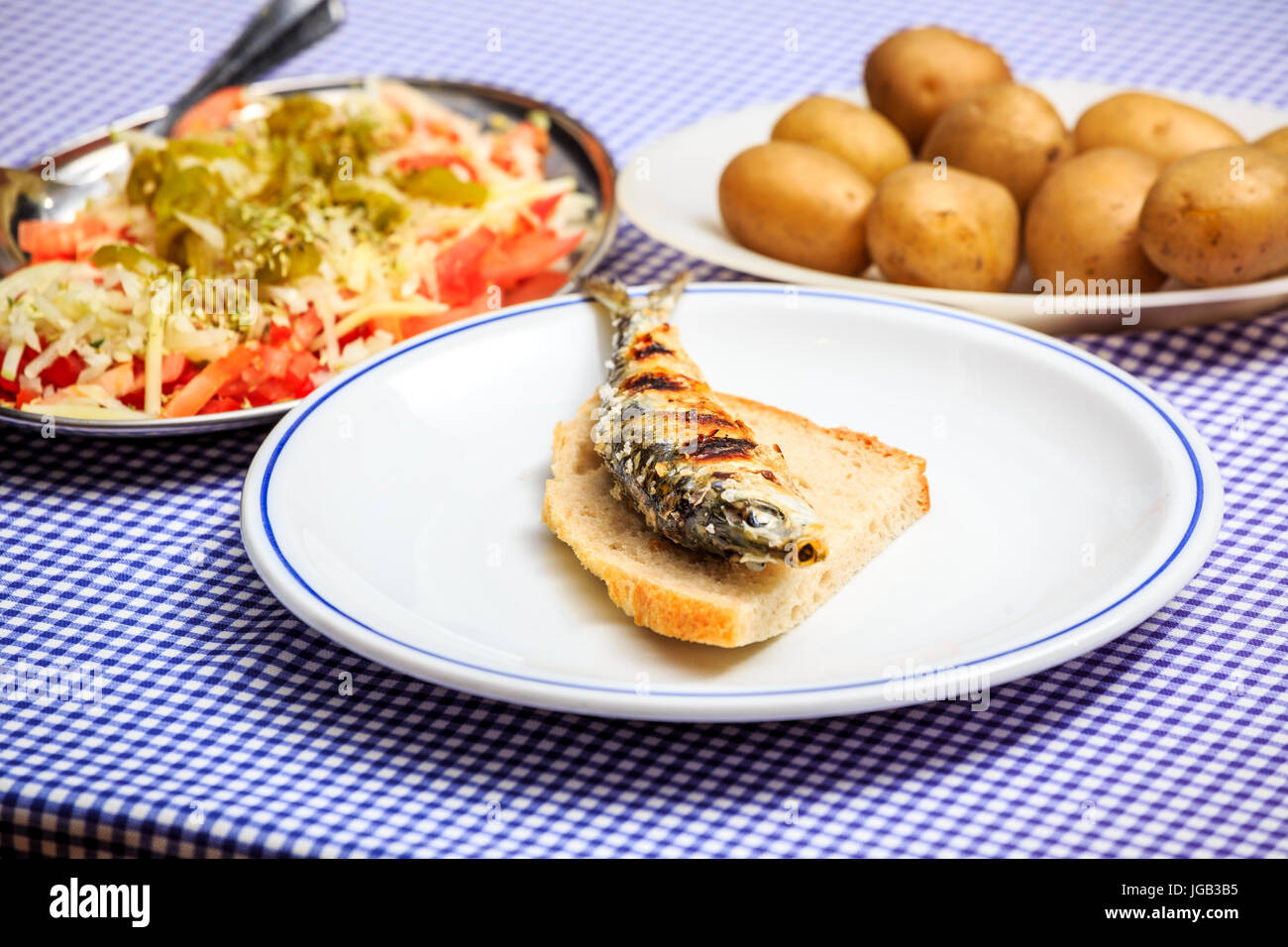 Grilled sardines with salad, bread and potato, Portugal Stock Photo Alamy