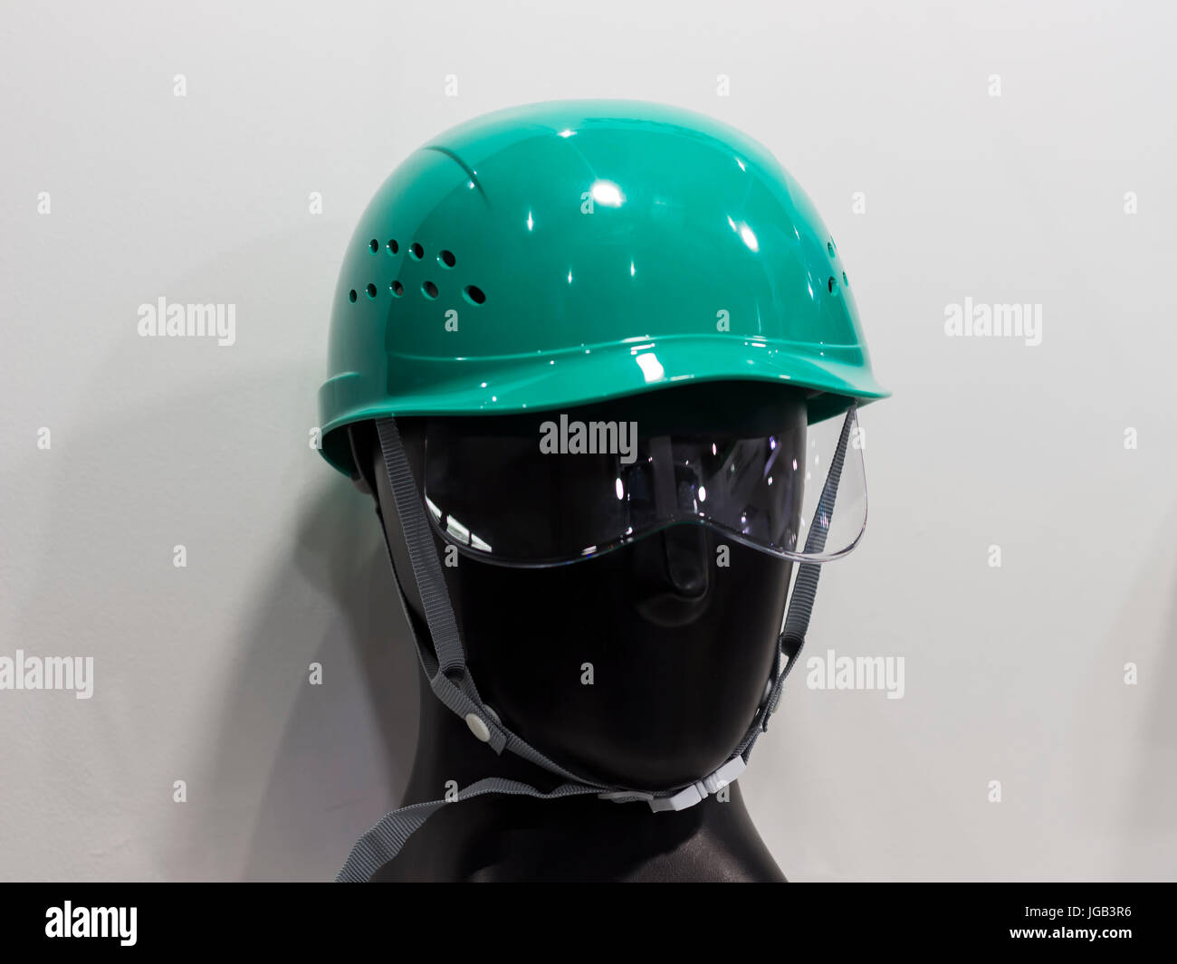 a mannequin with Safety helmets on a shelf ; Working Hard Hat;Personel