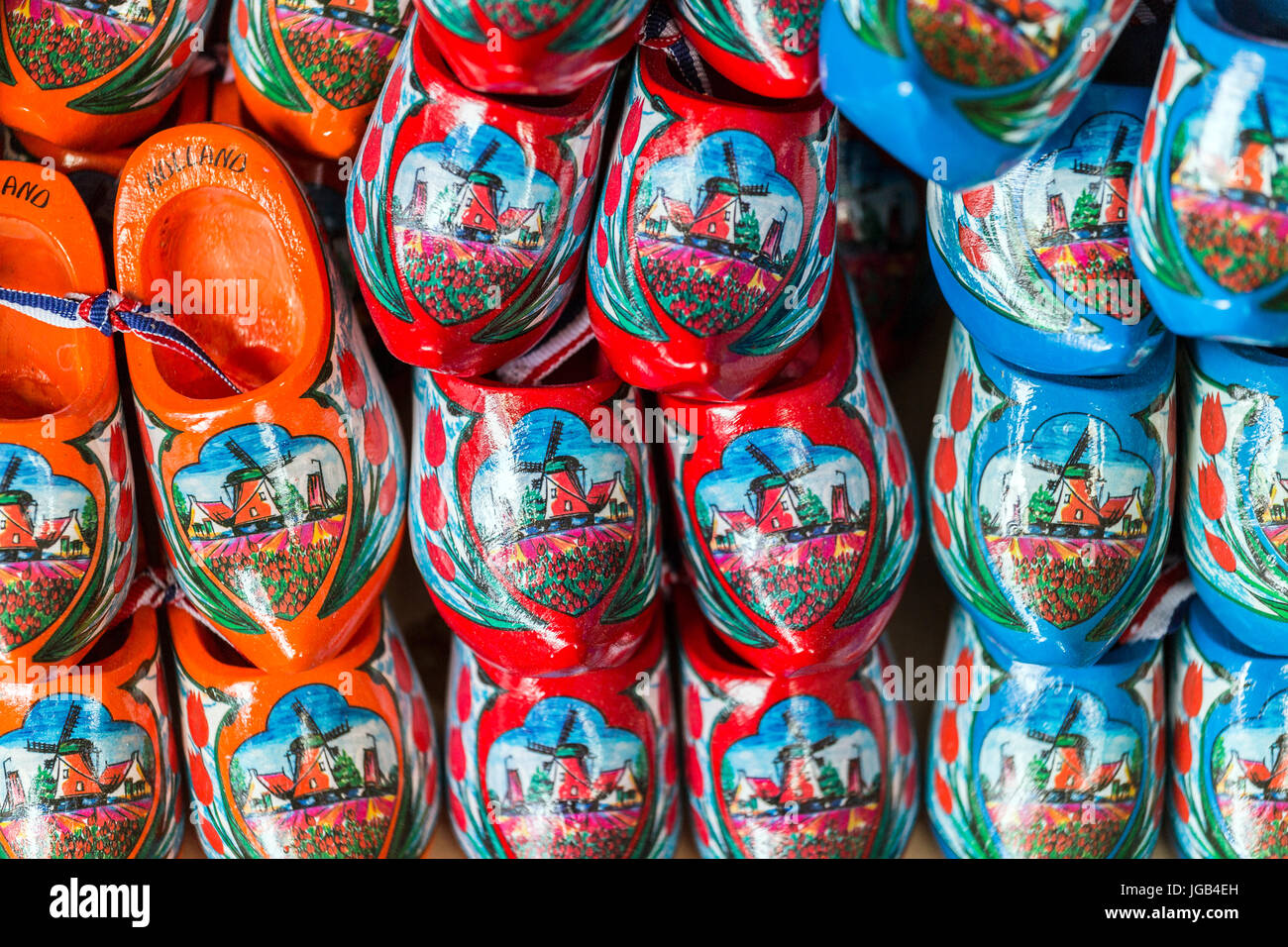 Orange, red and blue clogs as symbol of The Netherlands Stock Photo