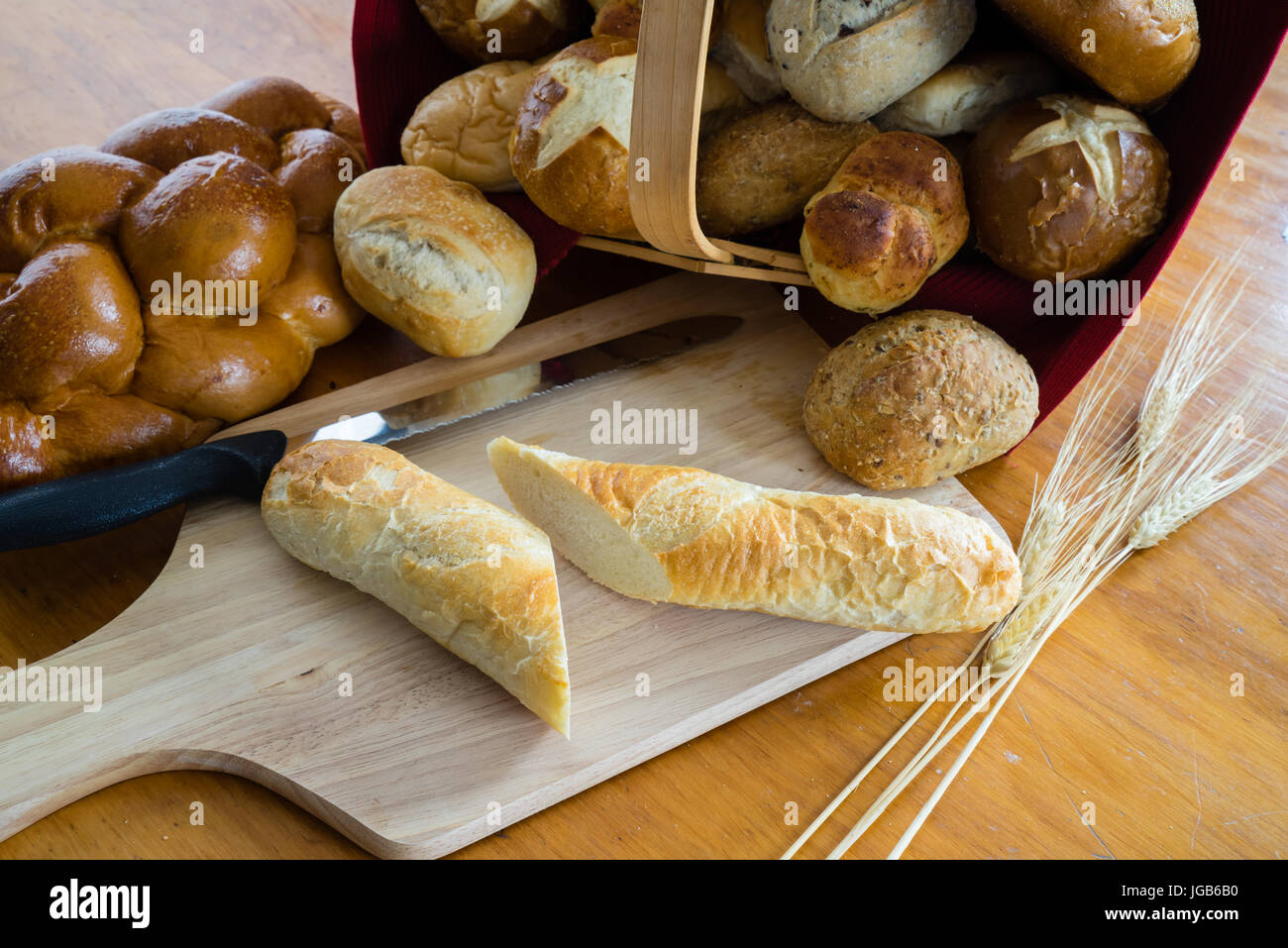 Collection of breads including Challah, baguettes and rolls Stock Photo