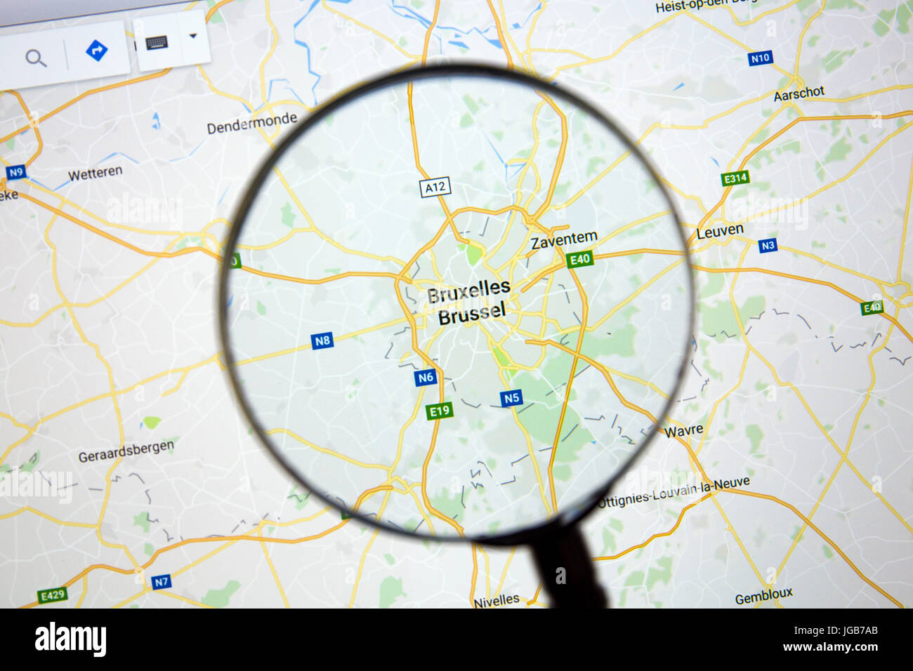 Map of Brussels on Google Maps under a magnifying glass. Stock Photo