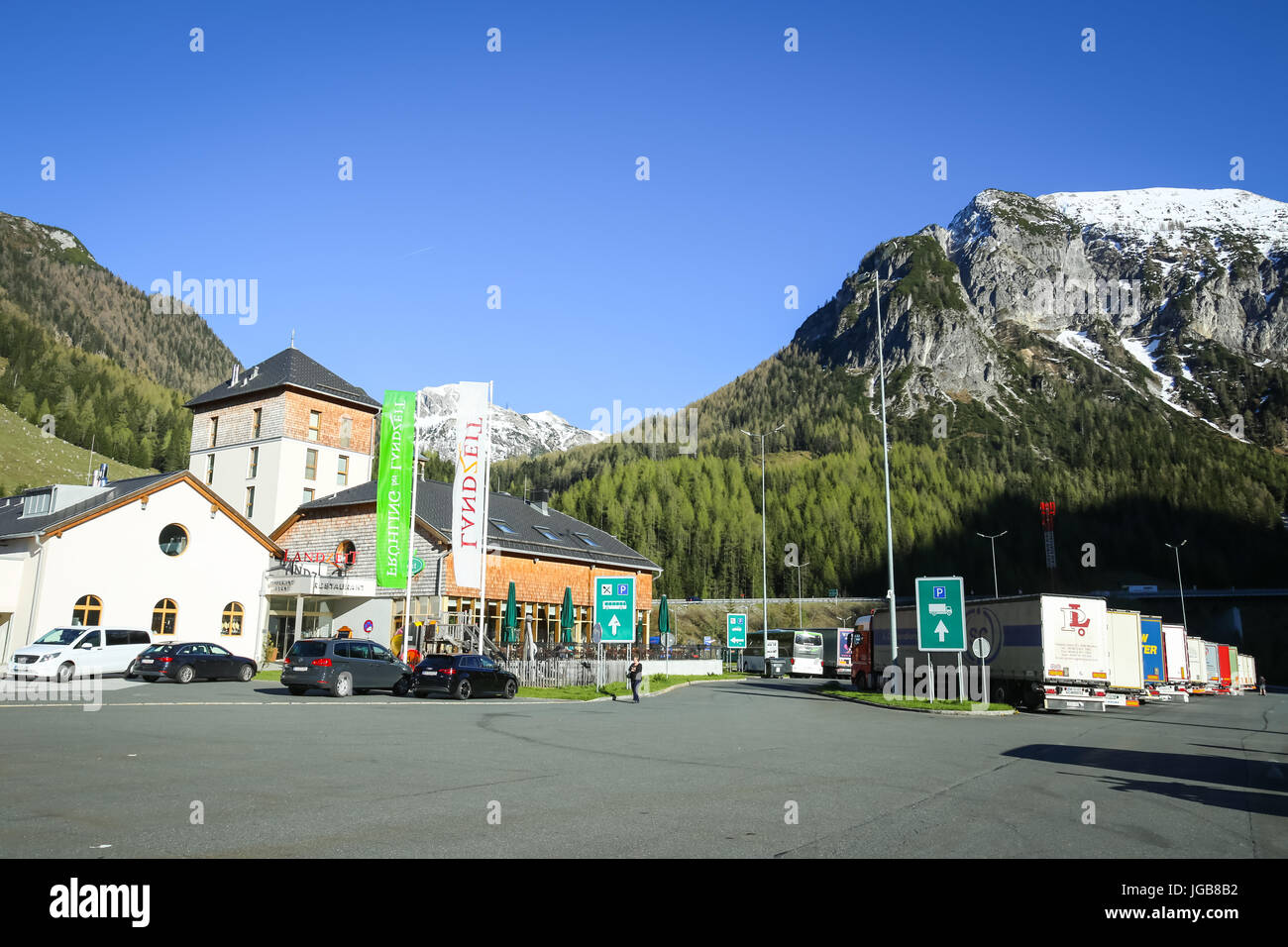 FLACHAU, AUSTRIA - MAY 10, 2017 : The highway rest stop with a gas station and the Landzeit Tauernalm hotel and restaurant in Alps environment in Flac Stock Photo