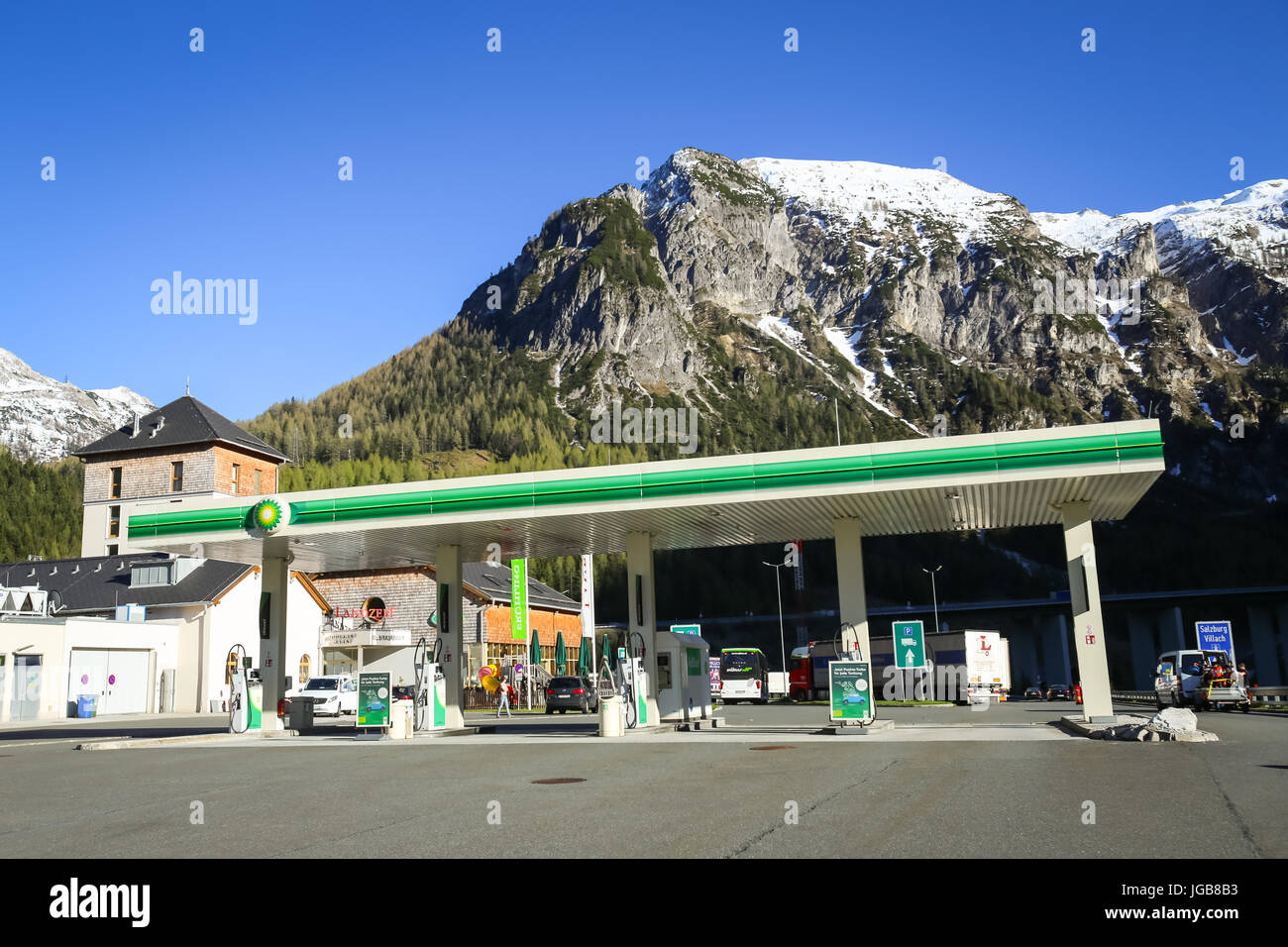 FLACHAU, AUSTRIA - MAY 10, 2017 : The highway rest stop with a BP gas station and the Landzeit Tauernalm hotel and restaurant in Alps environment in F Stock Photo