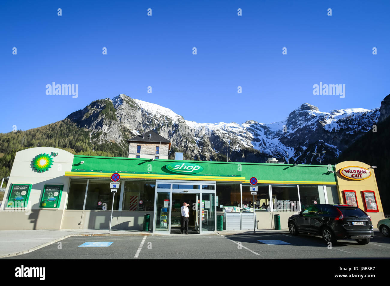 FLACHAU, AUSTRIA - MAY 10, 2017 : A BP gas station with a shop and the Landzeit Hotel on the highway rest stop in Alps environment in Flachau, Austria Stock Photo