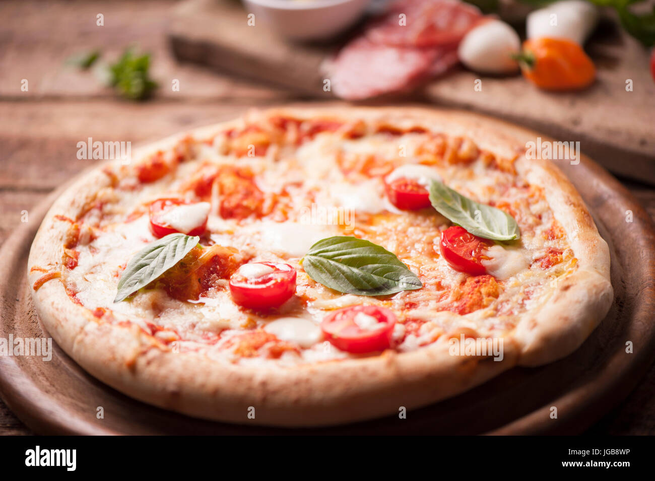 rustic italian pizza with mozzarella, cheese and basil leaves Stock ...