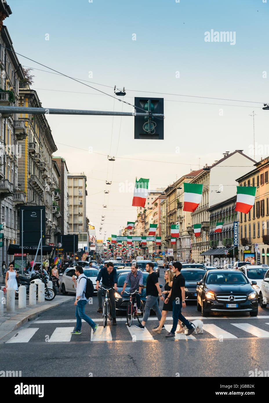 Milan, Italy - July 4th, 2017: Italian flags line up on Corso Buenos Aires street Milan Lombardy region Italy Europe, a busy shopping street Stock Photo