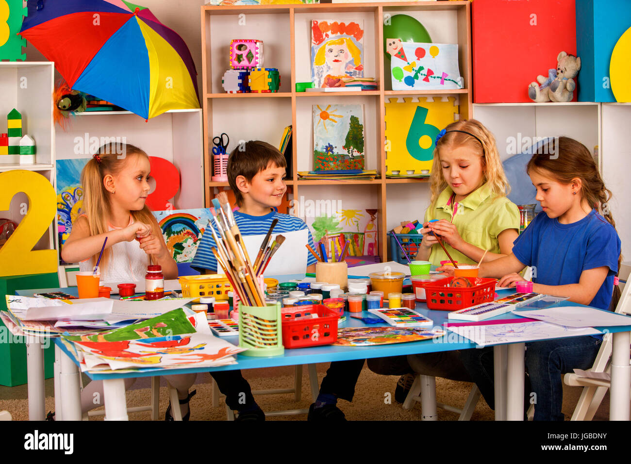 Small students girl painting in art school class Stock Photo - Alamy