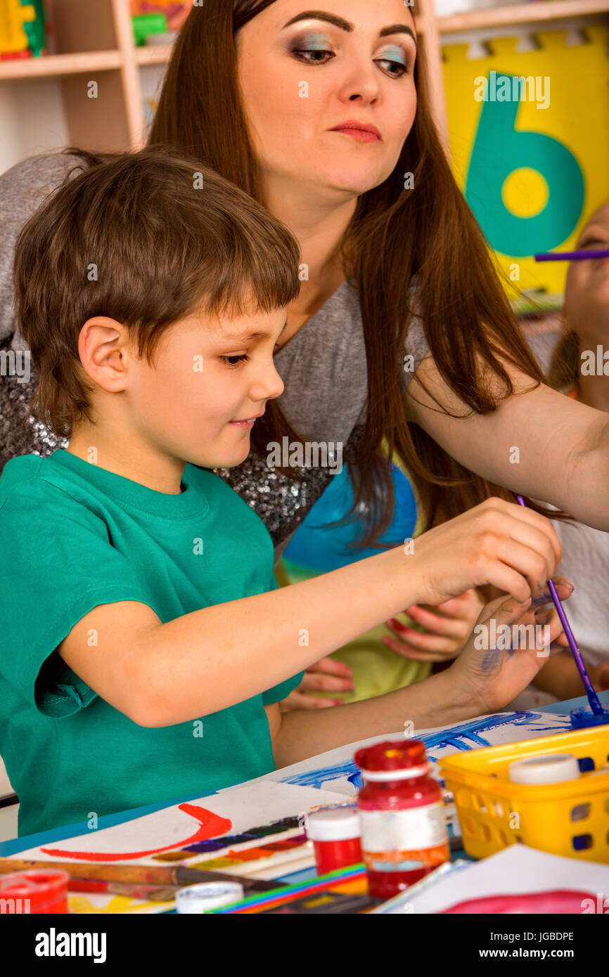 Small students girl and boy painting in art school class Stock Photo ...