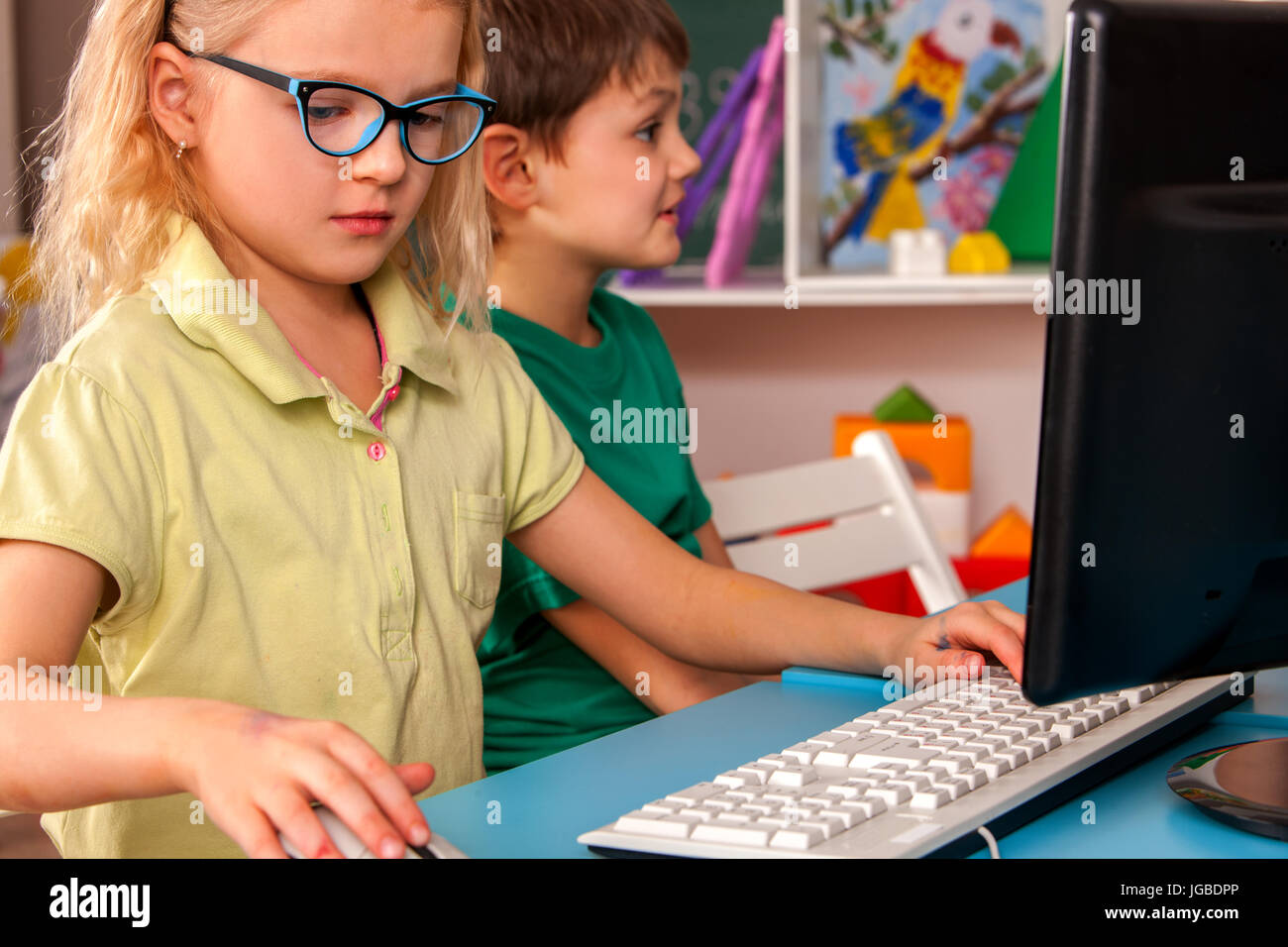 Children computer class us for education and video game Stock Photo - Alamy
