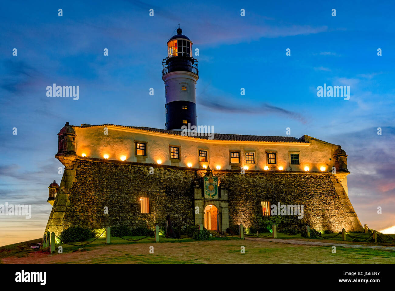 Night view of the famous and historic Barra Lighthouse on the banks of Todos os Santos bay in the city of Salvador, Bahia Stock Photo