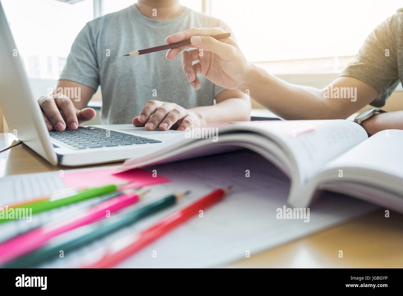 A Tutor Using Technology Teaching helping technology concept. Woman young teacher or tutor with ...