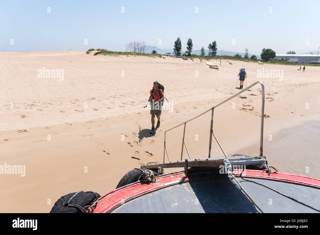 PIlgrims on the camino de Santiago approaching Laredo to Santona ferry, Cantabria, Spain Stock Photo