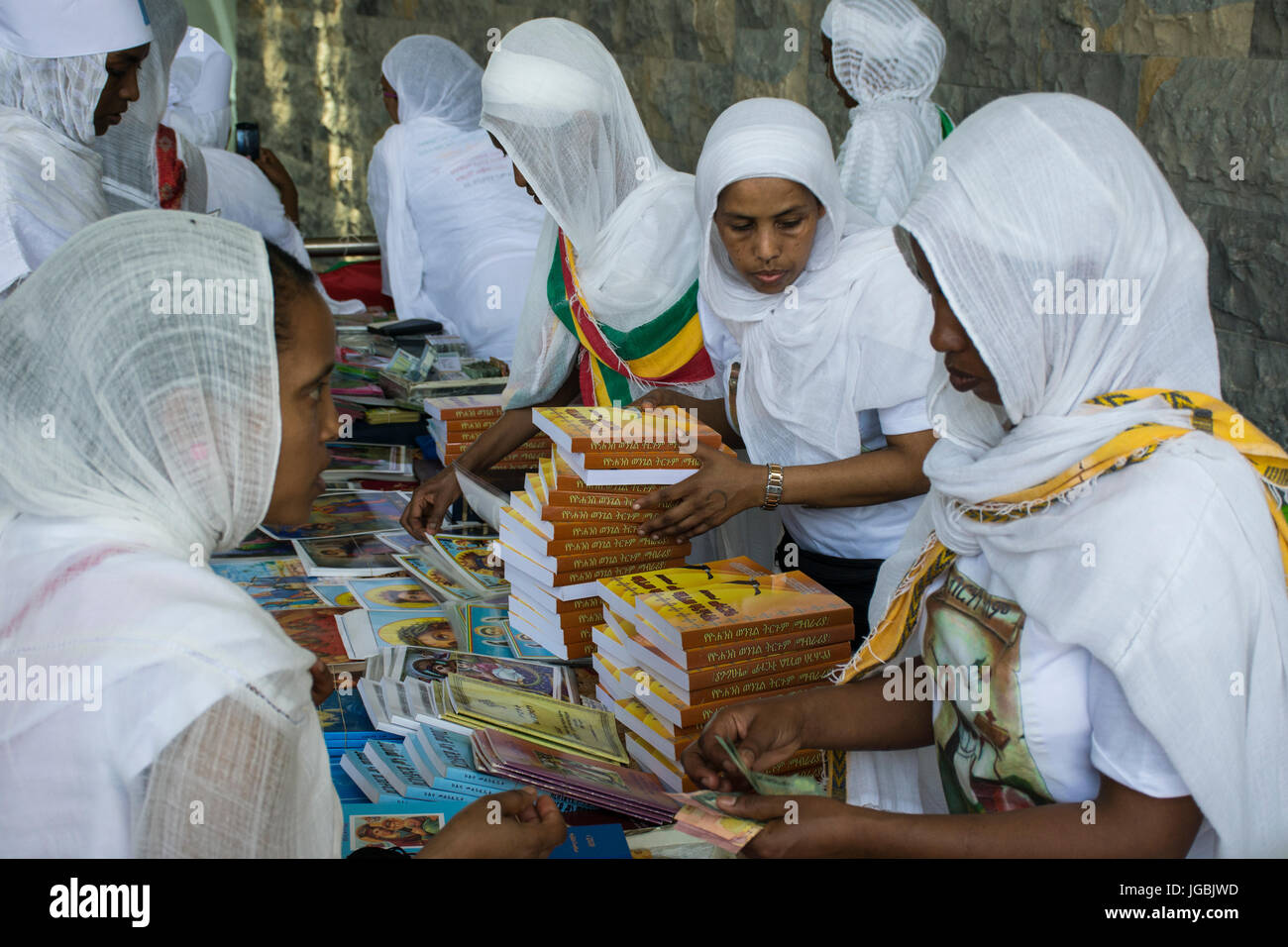 Ethiopian Orthodox Christian women selling religious books on a stand at the St Yared day inside Our Lady of Lebanon Church Stock Photo