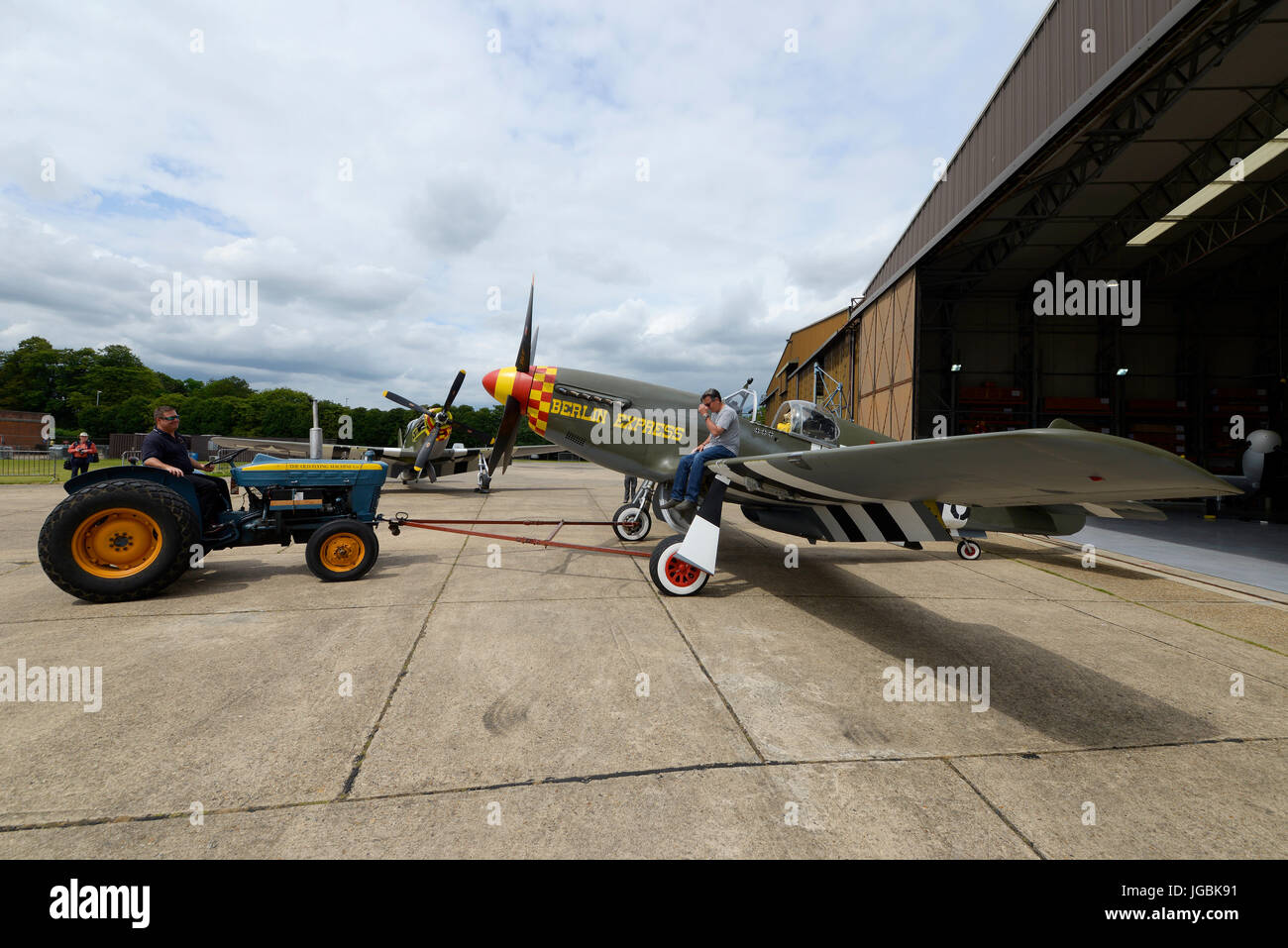 North American P-51B plane named Berlin Express which has flown from the US to appear at airshows in the UK. Duxford, Cambs. Tractor towing Stock Photo