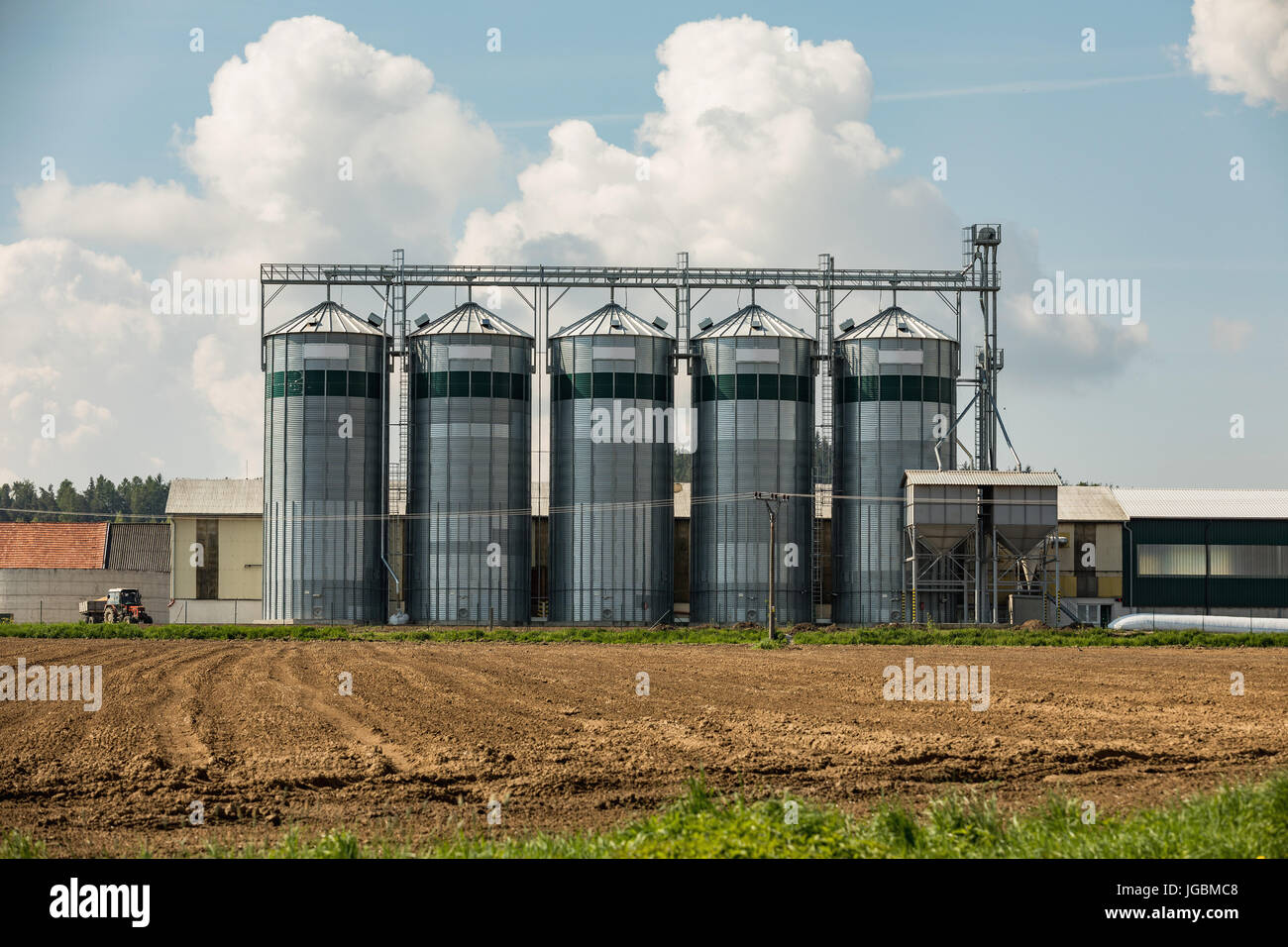 Silos on the field. Grain Storage Bins. Elevator to store grain in a