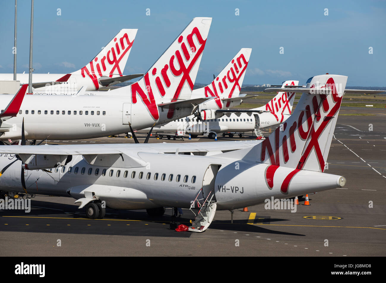 A group of Virgin Australlia Jets awaiting passengers at Melbourne Tullamarine Airport Stock Photo