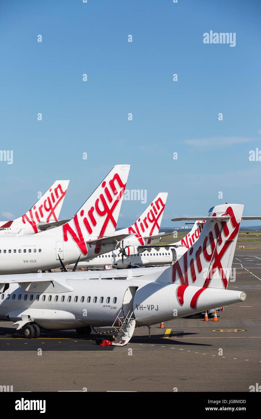 A group of Virgin Australlia Jets awaiting passengers at Melbourne Tullamarine Airport Stock Photo
