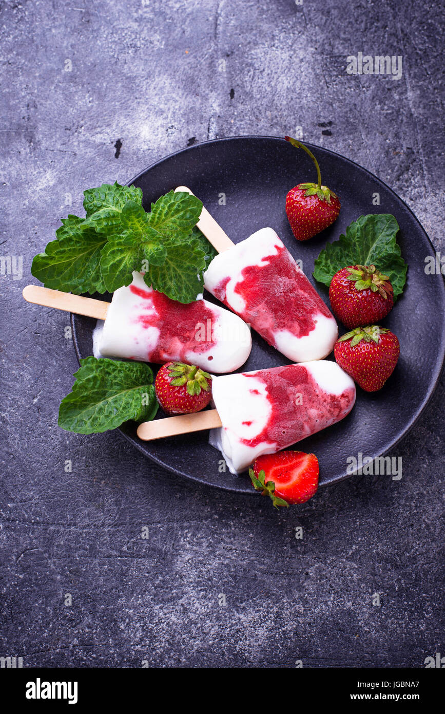 Strawberry vanilla popsicles. Homemade ice cream. Selective focus Stock Photo