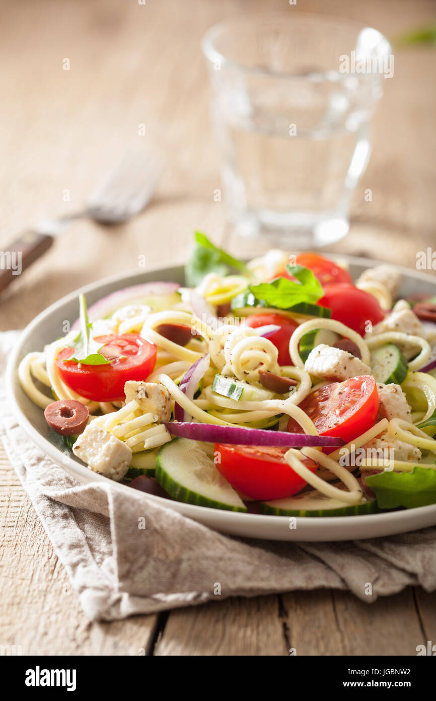 spiralized courgette salad greek style with tomato feta olives cucumber Stock Photo