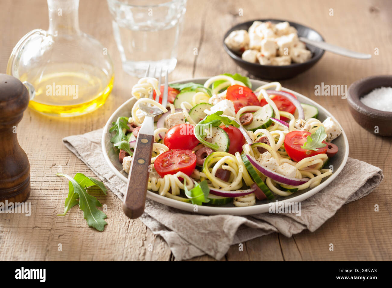 spiralized courgette salad greek style with tomato feta olives cucumber Stock Photo