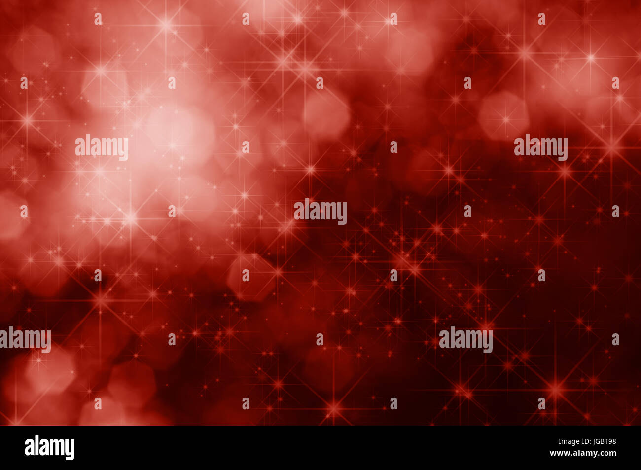 A red, sparkling Christmas background with twinkling stars and bokeh lights. Stock Photo