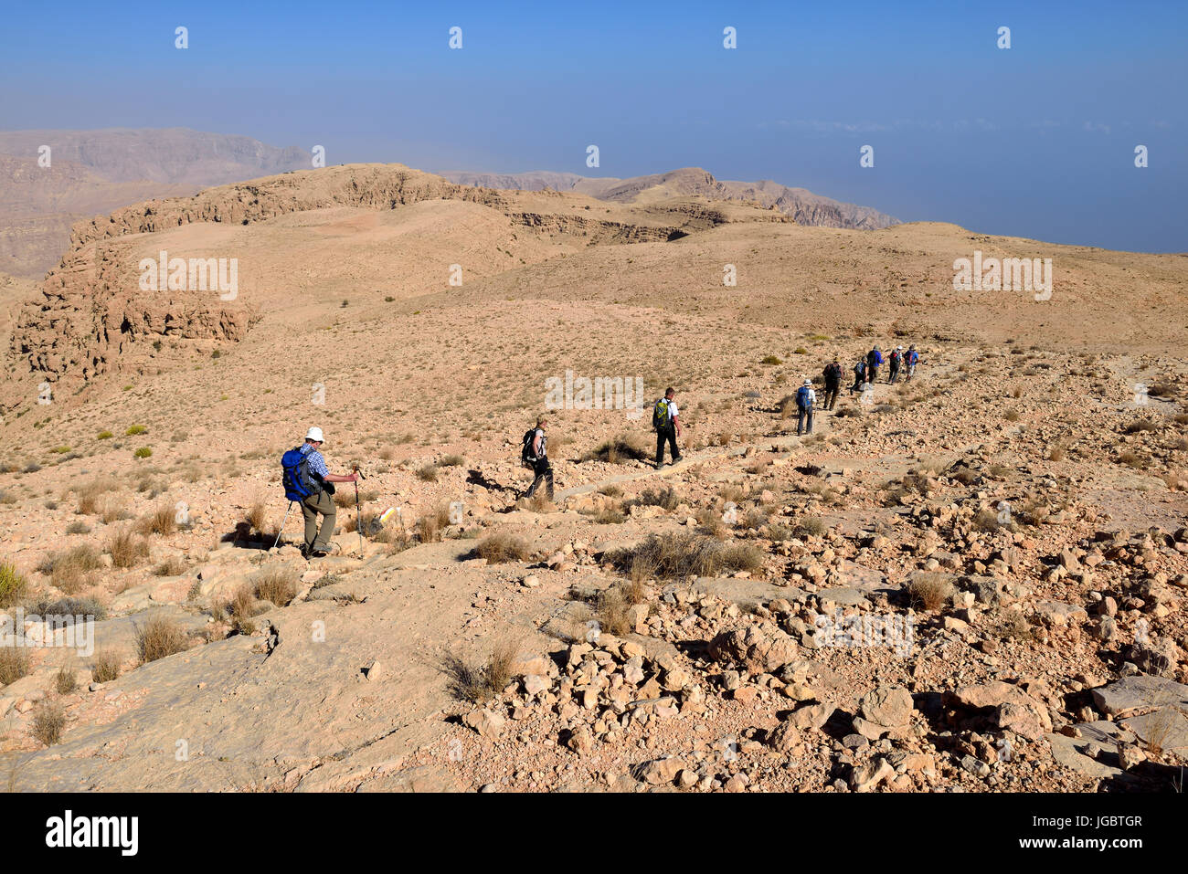 Tourists hiking above Wadi Tiwi, Al Hajar ash Sharqi mountains