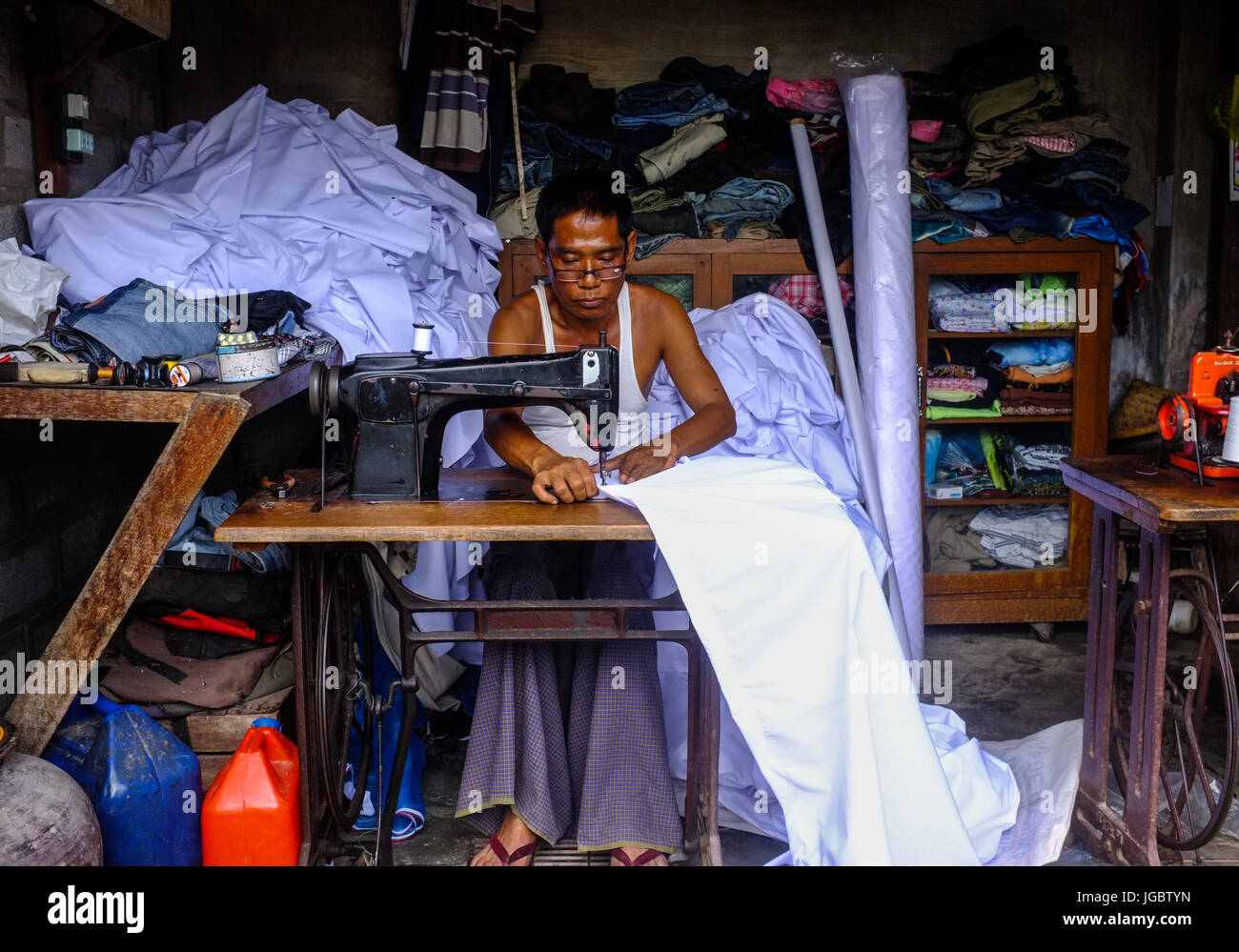 Male sewing machine operator, Nyaungshwe, Myanmar Stock Photo Alamy