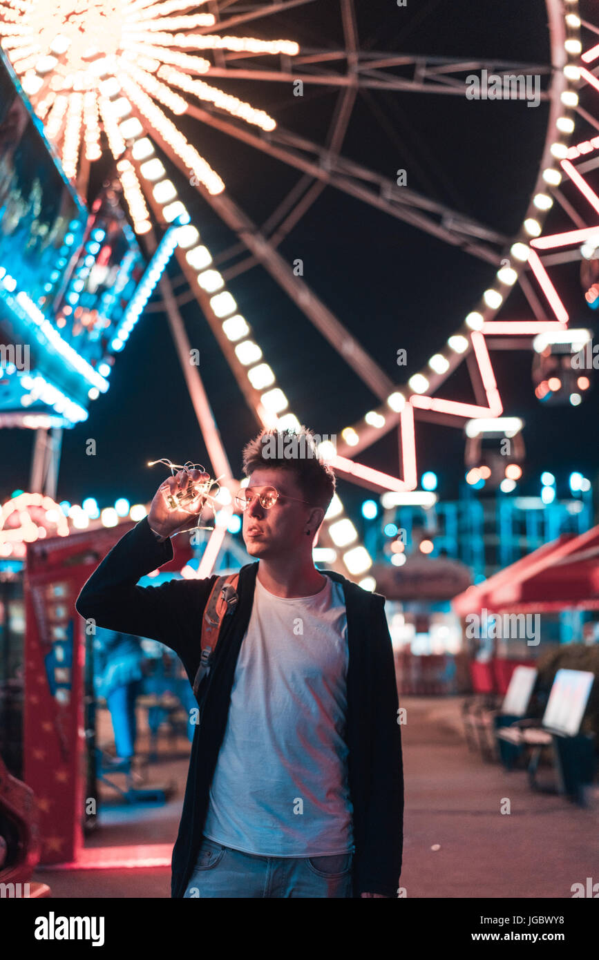 Guy in the amusement park Stock Photo