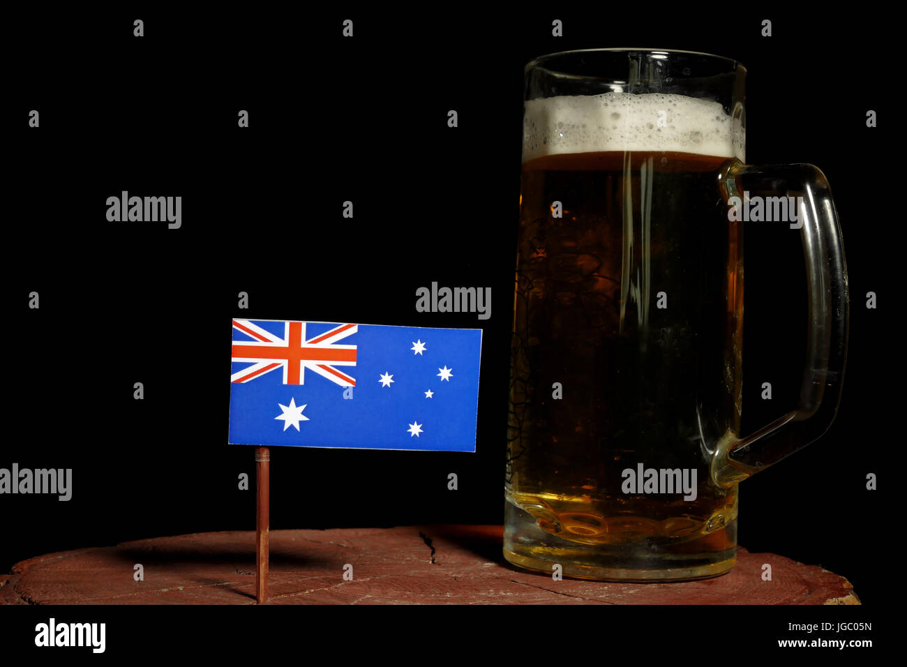 Australian flag with beer mug isolated on black background Stock Photo