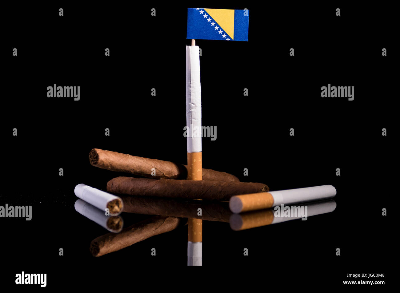 Bosnia and Herzegovina flag with cigarettes and cigars. Tobacco Industry  concept Stock Photo