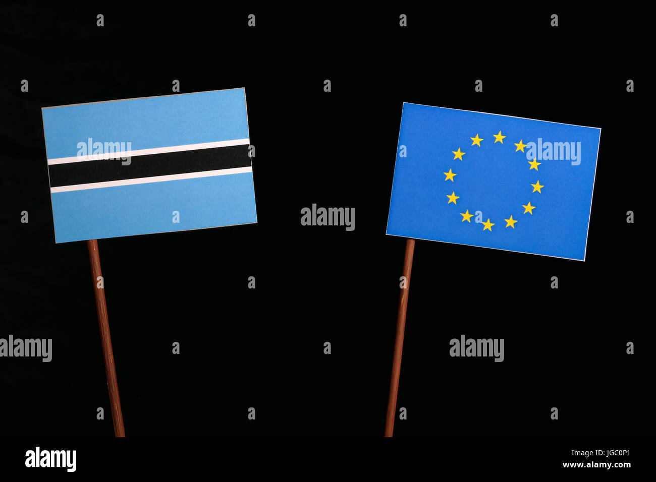 Botswana flag with European Union (EU) flag isolated on black