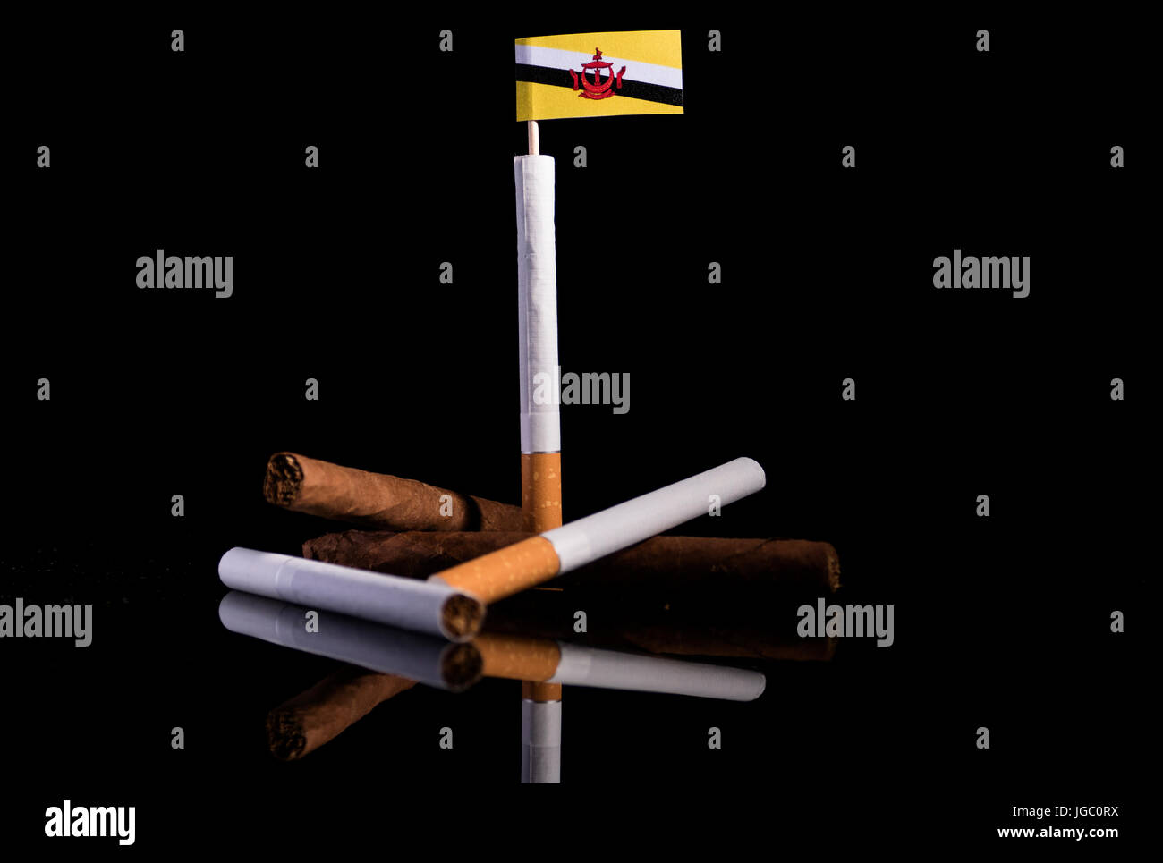 Brunei flag with cigarettes and cigars. Tobacco Industry concept Stock  Photo