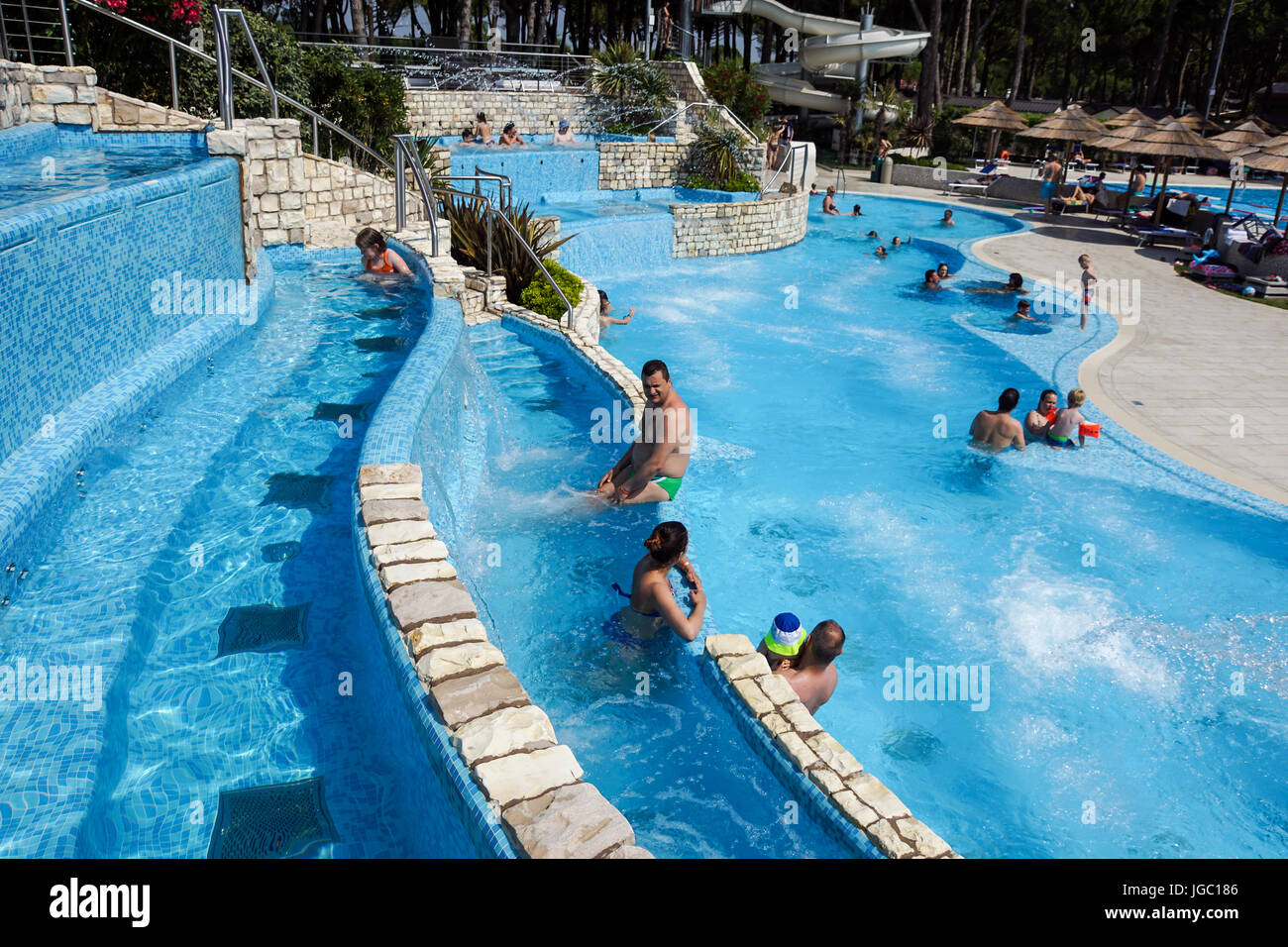 Torvaianica, Italy July 2017 People having fun in the swimming pool