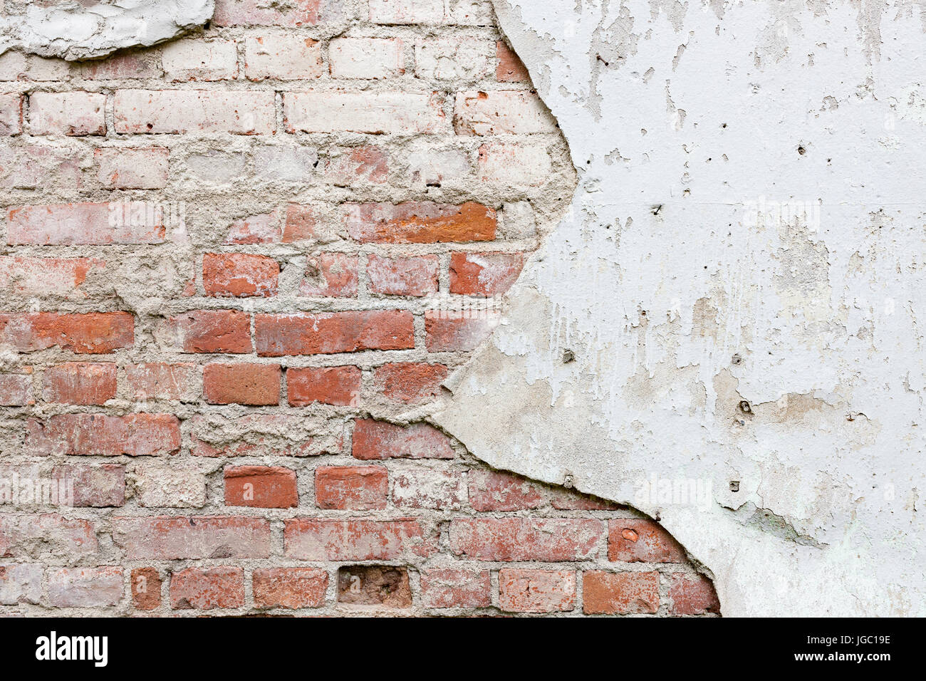 Aged brick wall with cracked plaster Stock Photo - Alamy
