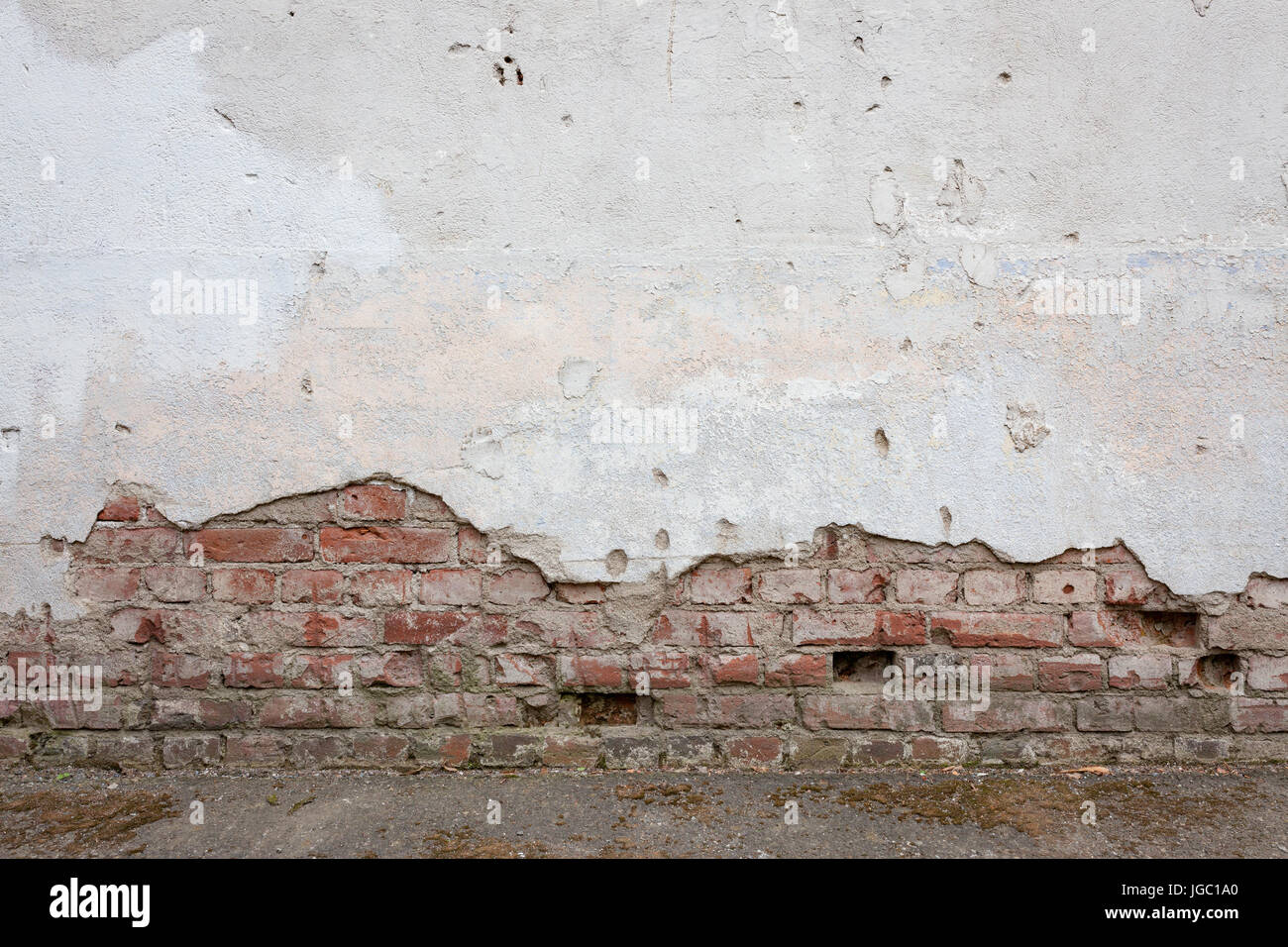 Aged brick wall with cracked plaster Stock Photo - Alamy