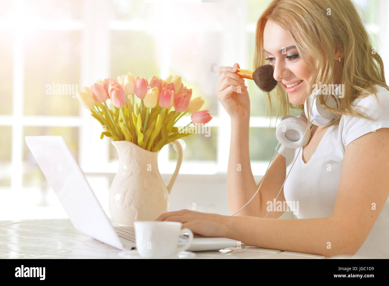 Beautiful young girl with a laptop Stock Photo - Alamy