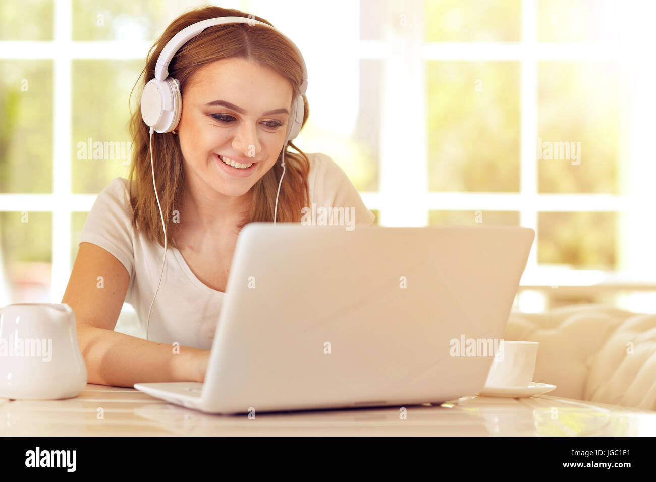 Beautiful young girl with a laptop Stock Photo - Alamy