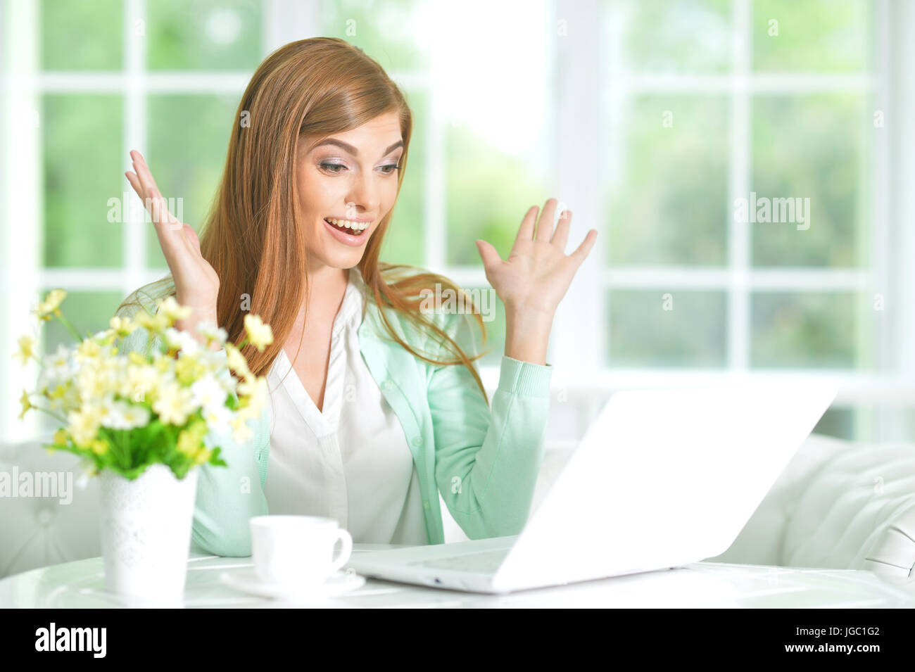 Beautiful young girl with a laptop Stock Photo - Alamy