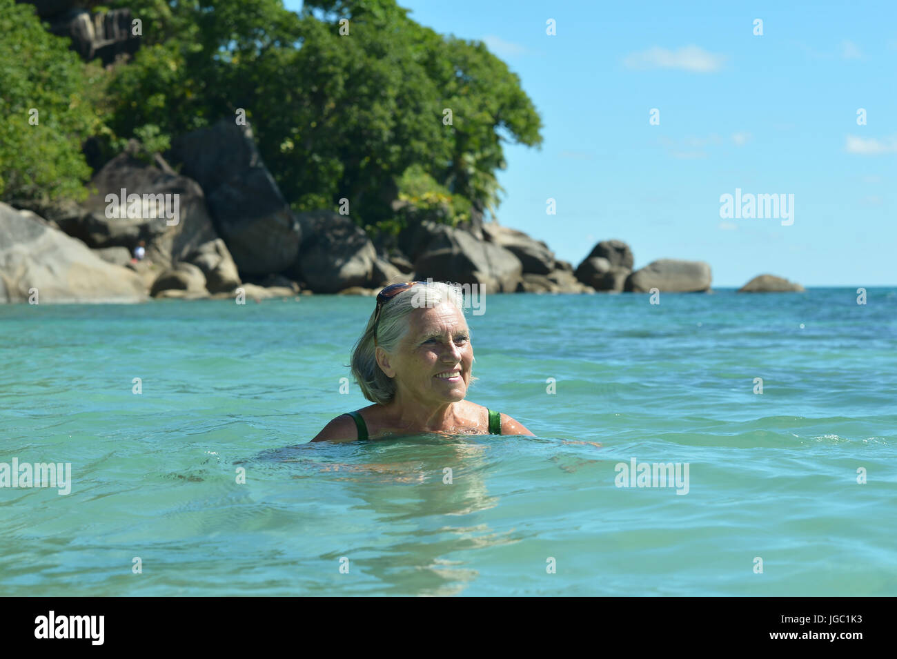 Older woman swimming hi-res stock photography and images - Alamy