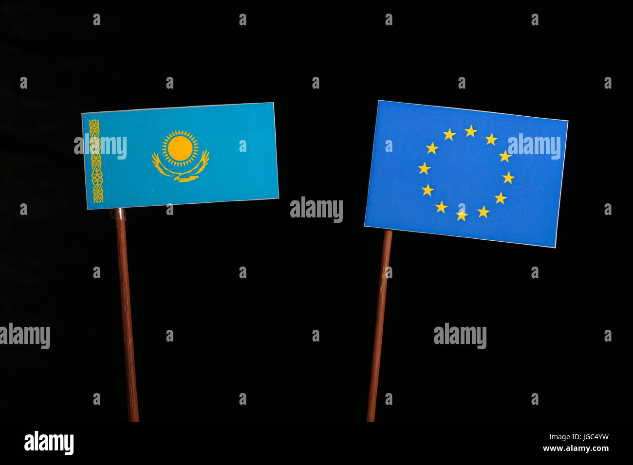 Kazakhstan flag with European Union (EU) flag isolated on black