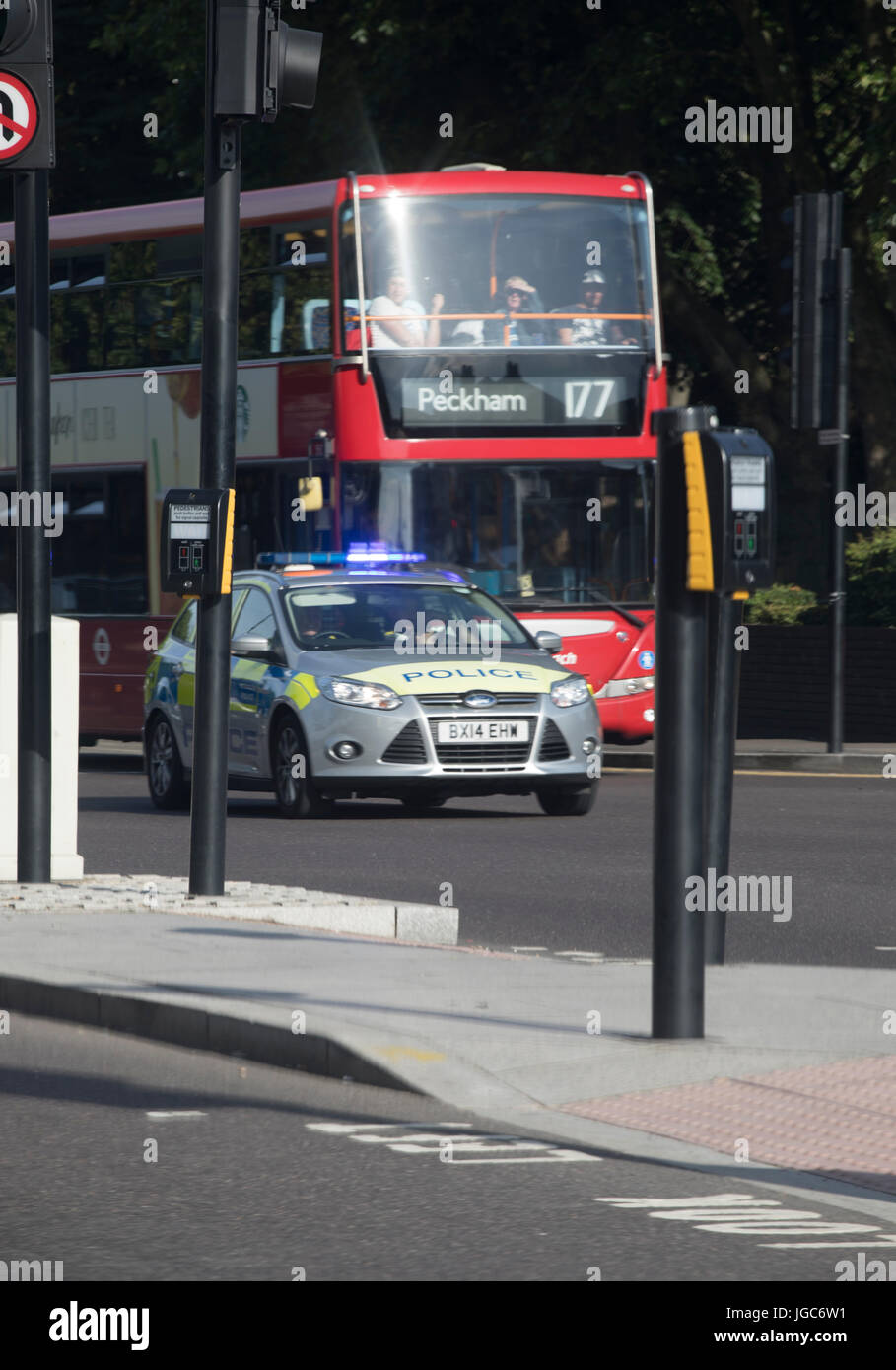 London Bus and police Car at a juntion Stock Photo