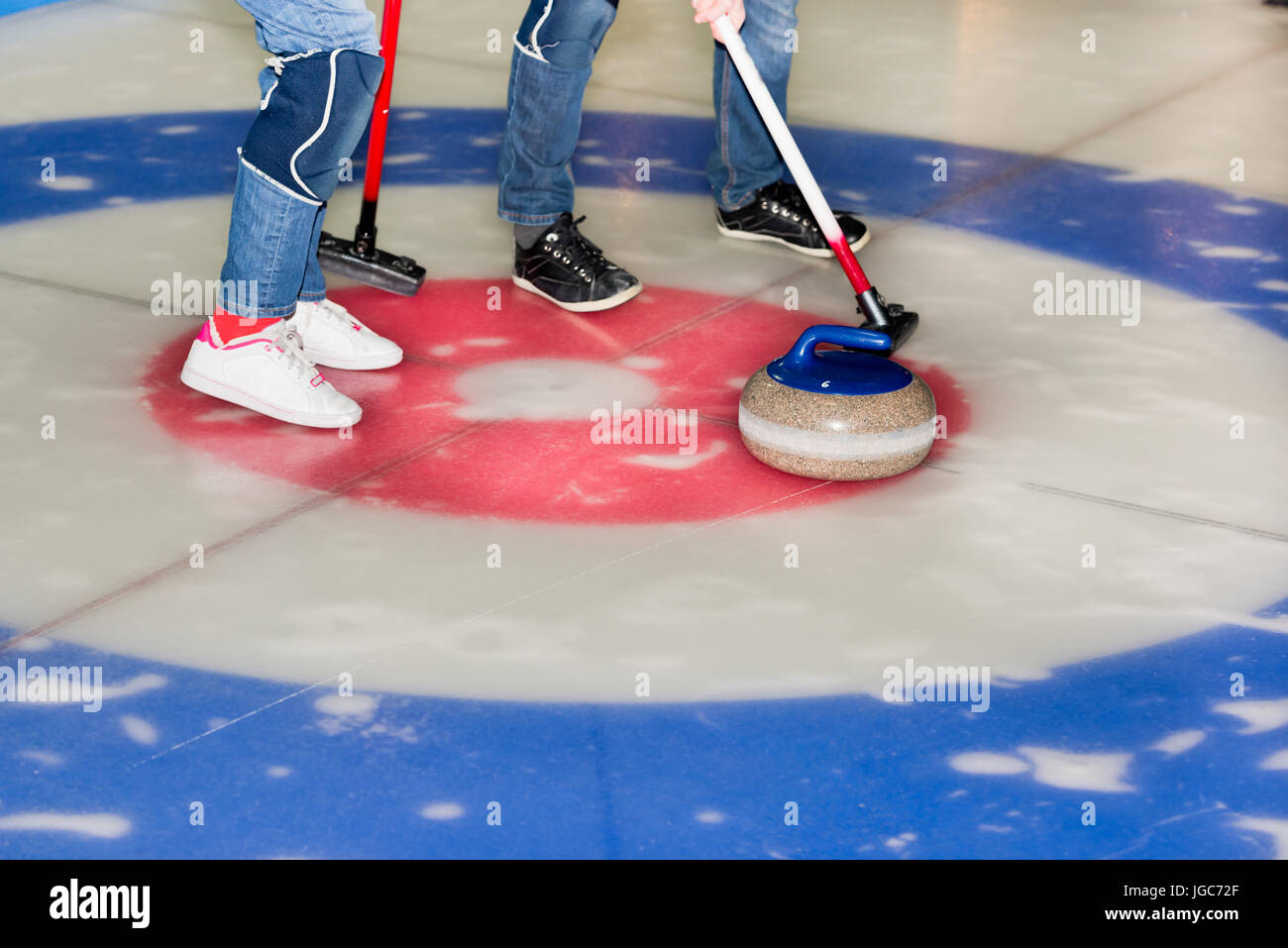 Equipment for curling sport game the ice Stock Photo Alamy